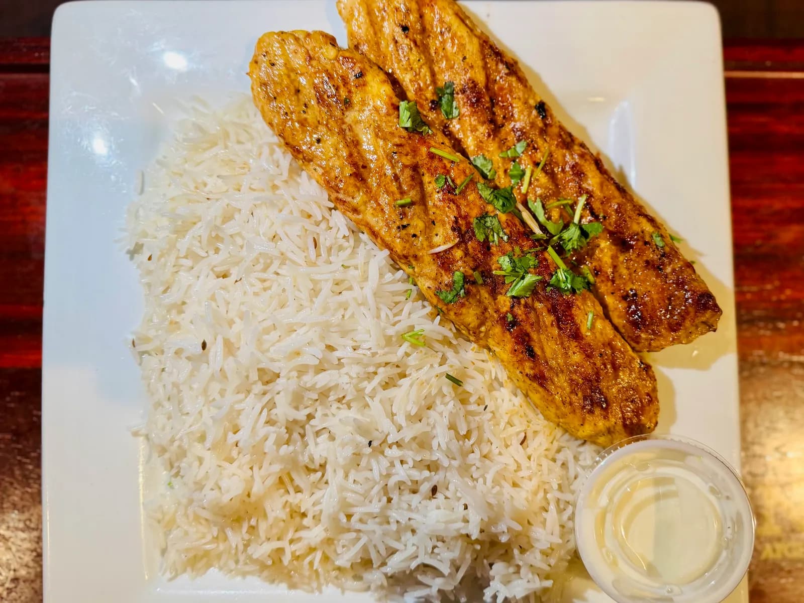 Chicken shami kabob with rice and salad