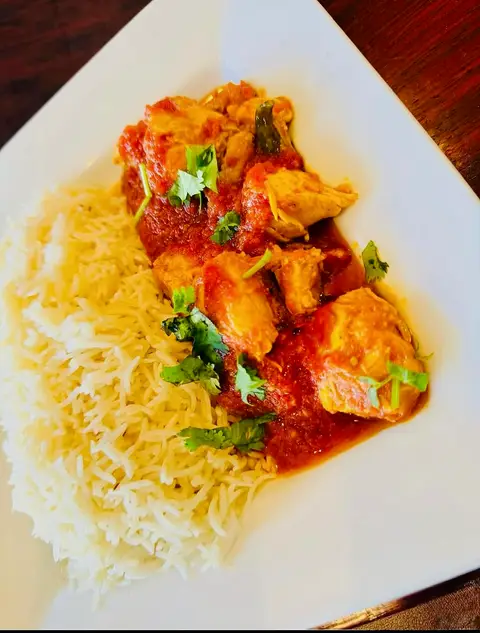Chicken karahi braised with tomato, ginger and green chilli