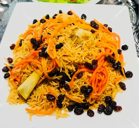 Qabli Palow — rice with caramelised carrots and raisins, with Lamb Shank