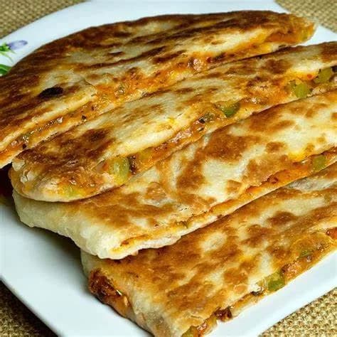 Bolani — pan-fried Afghan flatbread stuffed with spiced potato