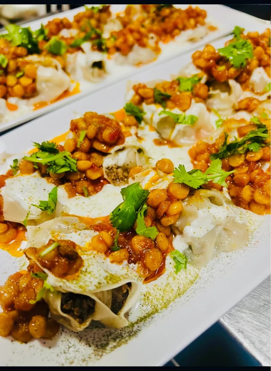 Mantu — Afghan beef dumplings with yogurt sauce and tomato